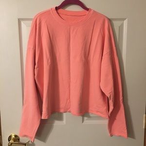 Faded neon pink cropped sweatshirt